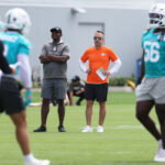 Jun 2, 2026; Miami Gardens, FL, USA; Miami Dolphins head coach Jeff Hafley watches mini camp with defensive quality control Coach Siriki Diabate at Baptist Health Training Complex. Mandatory Credit: Isabella Frias-Imagn Images