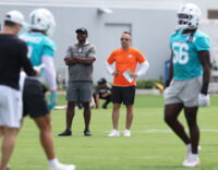 Jun 2, 2026; Miami Gardens, FL, USA; Miami Dolphins head coach Jeff Hafley watches mini camp with defensive quality control Coach Siriki Diabate at Baptist Health Training Complex. Mandatory Credit: Isabella Frias-Imagn Images