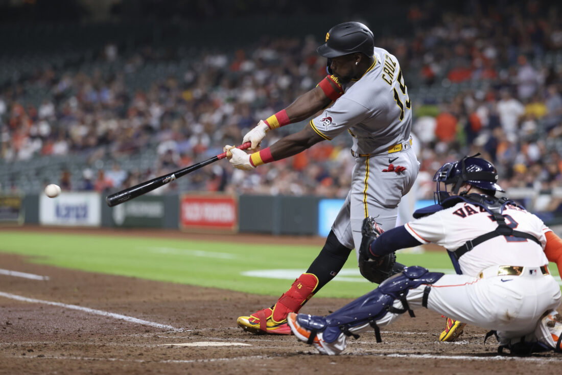 Jun 2, 2026; Houston, Texas, USA; Pittsburgh Pirates center fielder Oneil Cruz (15) hits a single during the fourth inning against the Houston Astros at Daikin Park. Mandatory Credit: Troy Taormina-Imagn Images
