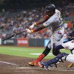 Jun 2, 2026; Houston, Texas, USA; Pittsburgh Pirates center fielder Oneil Cruz (15) hits a single during the fourth inning against the Houston Astros at Daikin Park. Mandatory Credit: Troy Taormina-Imagn Images