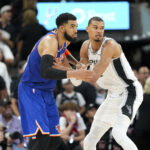 Jun 5, 2026; San Antonio, Texas, USA; New York Knicks center Karl-Anthony Towns (32) and San Antonio Spurs forward Victor Wembanyama (1) look for the ball in the second half during game two of the 2026 NBA Finals at Frost Bank Center. Mandatory Credit: Scott Wachter-Imagn Images