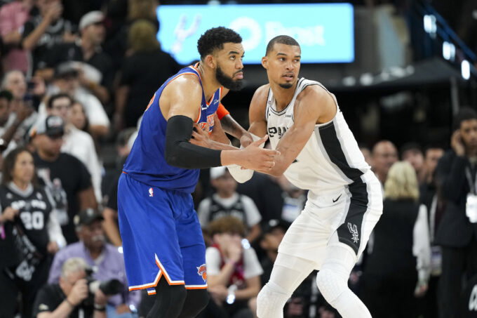 Jun 5, 2026; San Antonio, Texas, USA; New York Knicks center Karl-Anthony Towns (32) and San Antonio Spurs forward Victor Wembanyama (1) look for the ball in the second half during game two of the 2026 NBA Finals at Frost Bank Center. Mandatory Credit: Scott Wachter-Imagn Images