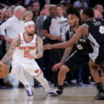 Jun 10, 2026; New York, New York, USA; New York Knicks guard Jose Alvarado (5) controls the ball against San Antonio Spurs guard Stephon Castle (5) and guard De'aaron Fox (4) during the fourth quarter of game four of the 2026 NBA Finals at Madison Square Garden. Mandatory Credit: Brad Penner-Imagn Images