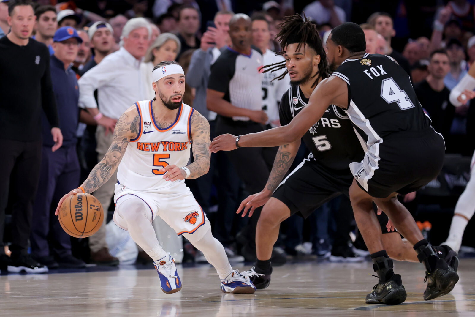 Jun 10, 2026; New York, New York, USA; New York Knicks guard Jose Alvarado (5) controls the ball against San Antonio Spurs guard Stephon Castle (5) and guard De'aaron Fox (4) during the fourth quarter of game four of the 2026 NBA Finals at Madison Square Garden. Mandatory Credit: Brad Penner-Imagn Images