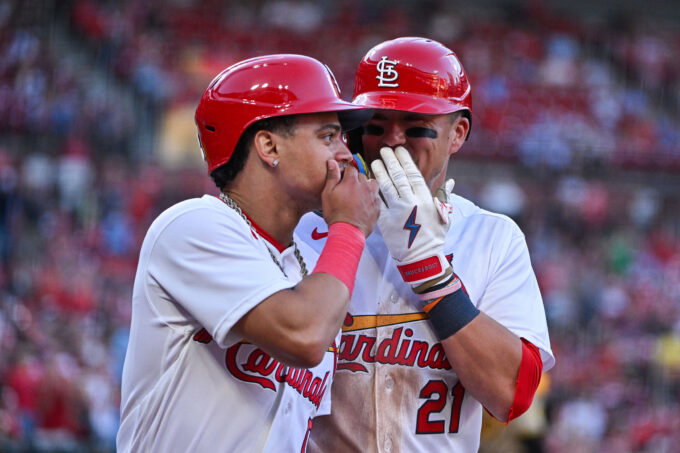 Jun 15, 2026; St. Louis, Missouri, USA; St. Louis Cardinals shortstop Masyn Winn (0) talks with left fielder Lars Nootbaar (21) after they both scored against the San Diego Padres during the fourth inning at Busch Stadium. Mandatory Credit: Jeff Curry-Imagn Images