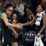 Jun 15, 2026; Minneapolis, Minnesota, USA; Minnesota Lynx guard Courtney Williams (10) and guard Olivia Miles (5) celebrates a teammate making a shot against the Portland Fire in the second half at Target Center. Mandatory Credit: Jesse Johnson-Imagn Images