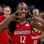 Jun 21, 2026; Minneapolis, Minnesota, USA; Washington Mystics forward Michaela Onyenwere (12) celebrates the teams win against the Minnesota Lynx during the second half at Target Center. Mandatory Credit: Matt Krohn-Imagn Images