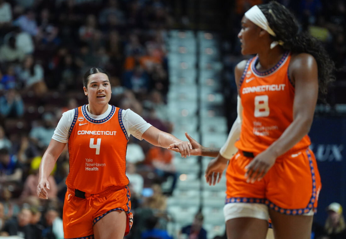 Jun 22, 2026; Uncasville, Connecticut, USA; Connecticut Sun guard Charlisse Leger-Walker (4) reacts with teammates after a play against the Chicago Sky in the second half at Mohegan Sun Arena. Mandatory Credit: David Butler II-Imagn Images