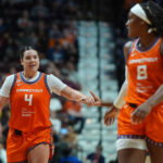 Jun 22, 2026; Uncasville, Connecticut, USA; Connecticut Sun guard Charlisse Leger-Walker (4) reacts with teammates after a play against the Chicago Sky in the second half at Mohegan Sun Arena. Mandatory Credit: David Butler II-Imagn Images