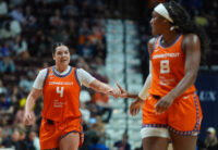 Jun 22, 2026; Uncasville, Connecticut, USA; Connecticut Sun guard Charlisse Leger-Walker (4) reacts with teammates after a play against the Chicago Sky in the second half at Mohegan Sun Arena. Mandatory Credit: David Butler II-Imagn Images
