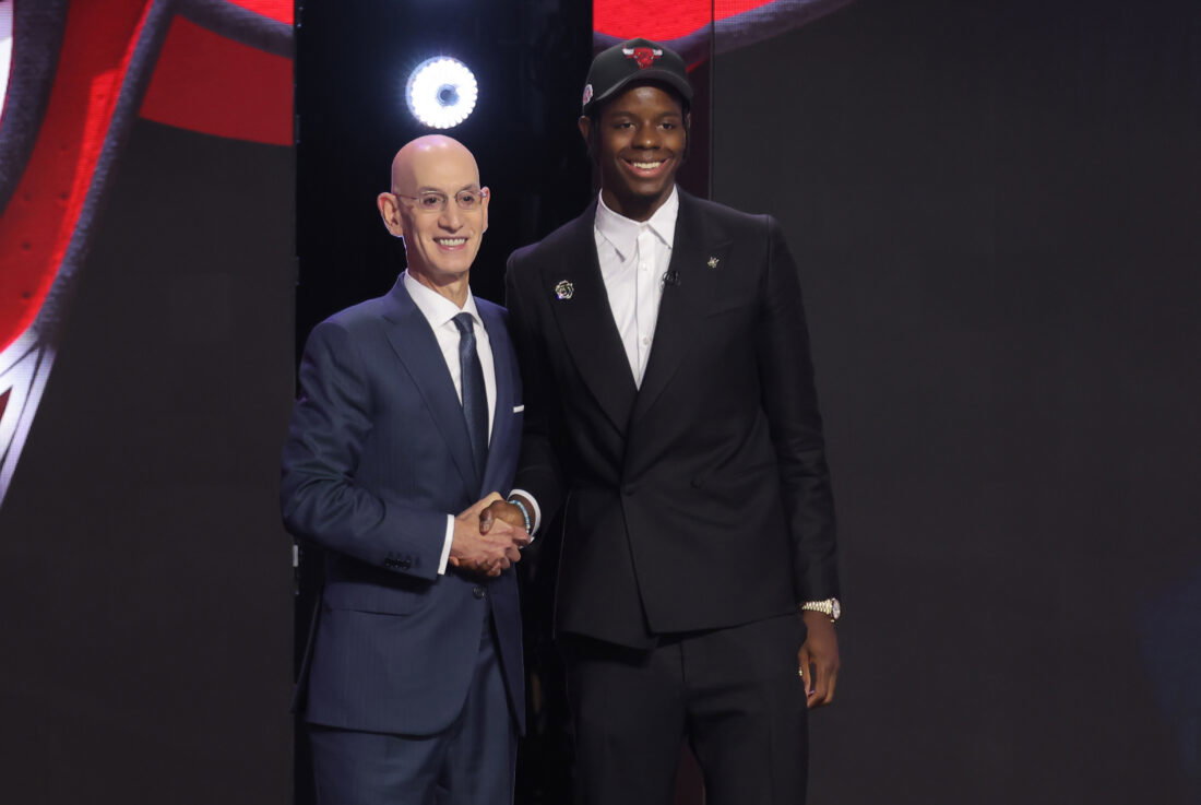 Jun 23, 2026; New York, NY, USA; NBA commissioner Adam Silver greets the fourth pick in the 2026 NBA draft, North Carolina forward Caleb Wilson after he was selected by the Chicago Bulls at Barclays Center. Mandatory Credit: Brad Penner-Imagn Images