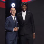 Jun 23, 2026; New York, NY, USA; NBA commissioner Adam Silver greets the fourth pick in the 2026 NBA draft, North Carolina forward Caleb Wilson after he was selected by the Chicago Bulls at Barclays Center. Mandatory Credit: Brad Penner-Imagn Images