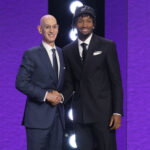 Jun 23, 2026; New York, NY, USA; NBA commissioner Adam Silver greets the second pick in the 2026 NBA draft, Kansas guard Darryn Peterson after he was selected by the Utah Jazz at Barclays Center. Mandatory Credit: Brad Penner-Imagn Images