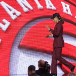 Jun 23, 2026; New York, NY, USA; The eighth pick in the 2026 NBA draft, Houston guard Kingston Flemings after he was selected by the Atlanta Hawks at Barclays Center. Mandatory Credit: Brad Penner-Imagn Images