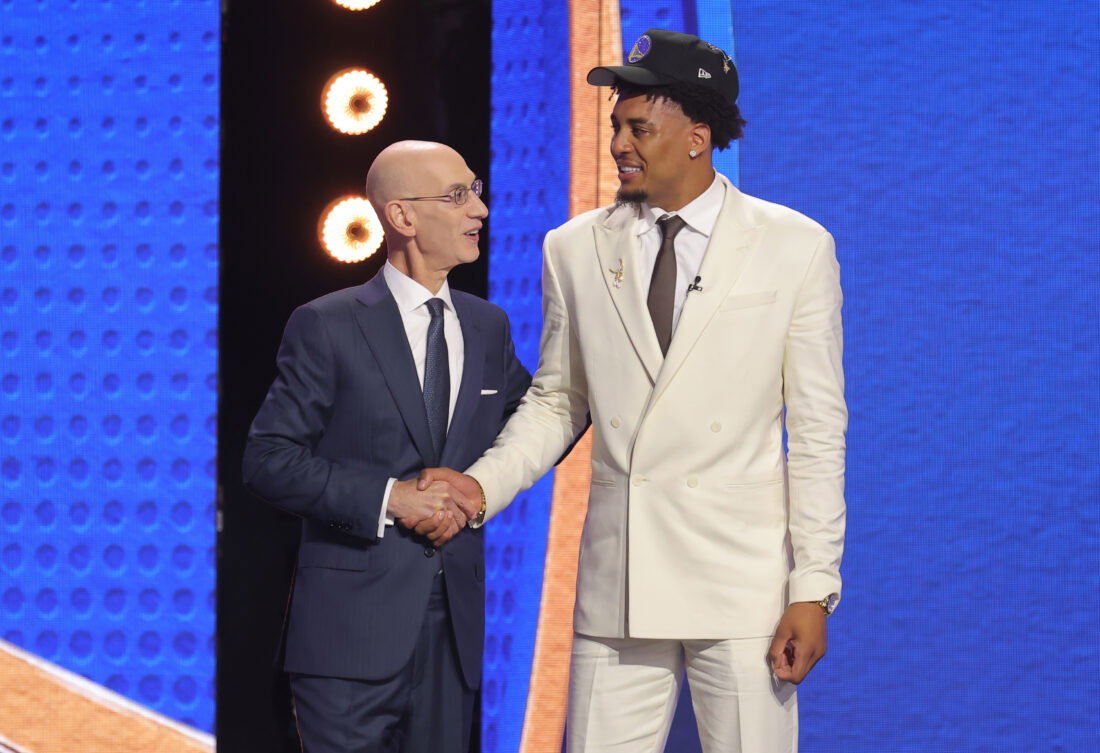 Jun 23, 2026; New York, NY, USA; NBA commissioner Adam Silver greets the eleventh pick in the 2026 NBA draft, Michigan forward Yaxel Lendeborg after he was selected by the Golden State Warriors at Barclays Center. Mandatory Credit: Brad Penner-Imagn Images