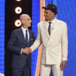 Jun 23, 2026; New York, NY, USA; NBA commissioner Adam Silver greets the eleventh pick in the 2026 NBA draft, Michigan forward Yaxel Lendeborg after he was selected by the Golden State Warriors at Barclays Center. Mandatory Credit: Brad Penner-Imagn Images