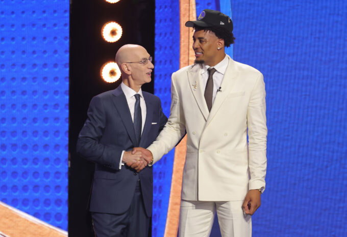 Jun 23, 2026; New York, NY, USA; NBA commissioner Adam Silver greets the eleventh pick in the 2026 NBA draft, Michigan forward Yaxel Lendeborg after he was selected by the Golden State Warriors at Barclays Center. Mandatory Credit: Brad Penner-Imagn Images