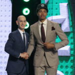 Jun 23, 2026; New York, NY, USA; NBA commissioner Adam Silver greets the twenty seventh pick in the 2026 NBA draft, Houston forward Chris Cenac Jr. after he was selected by the Boston Celtics at Barclays Center. Mandatory Credit: Brad Penner-Imagn Images
