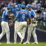 Jun 26, 2026; Milwaukee, Wisconsin, USA; Milwaukee Brewers second baseman Brice Turang (2), shortstop Cooper Pratt (12), first baseman Jake Bauers (9), and third baseman David Hamilton (6) celebrate a 6-2 win over the Chicago Cubs at American Family Field. Mandatory Credit: Michael McLoone-Imagn Images
