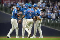 Jun 26, 2026; Milwaukee, Wisconsin, USA; Milwaukee Brewers second baseman Brice Turang (2), shortstop Cooper Pratt (12), first baseman Jake Bauers (9), and third baseman David Hamilton (6) celebrate a 6-2 win over the Chicago Cubs at American Family Field. Mandatory Credit: Michael McLoone-Imagn Images
