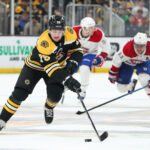 Mar 23, 2023; Boston, Massachusetts, USA; Boston Bruins defenseman Connor Clifton (75) possesses the puck during the third period against the Montreal Canadiens at TD Garden. Mandatory Credit: Paul Rutherford-USA TODAY Sports