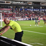 Apr 19, 2025; Sandy, Utah, USA; Referee Sergii Demianchuk checks the video assisted review after issuing a red card to Real Salt Lake midfielder Diego Luna (8) in the second half against Toronto FC at America First Field. Mandatory Credit: Jamie Sabau-Imagn Images