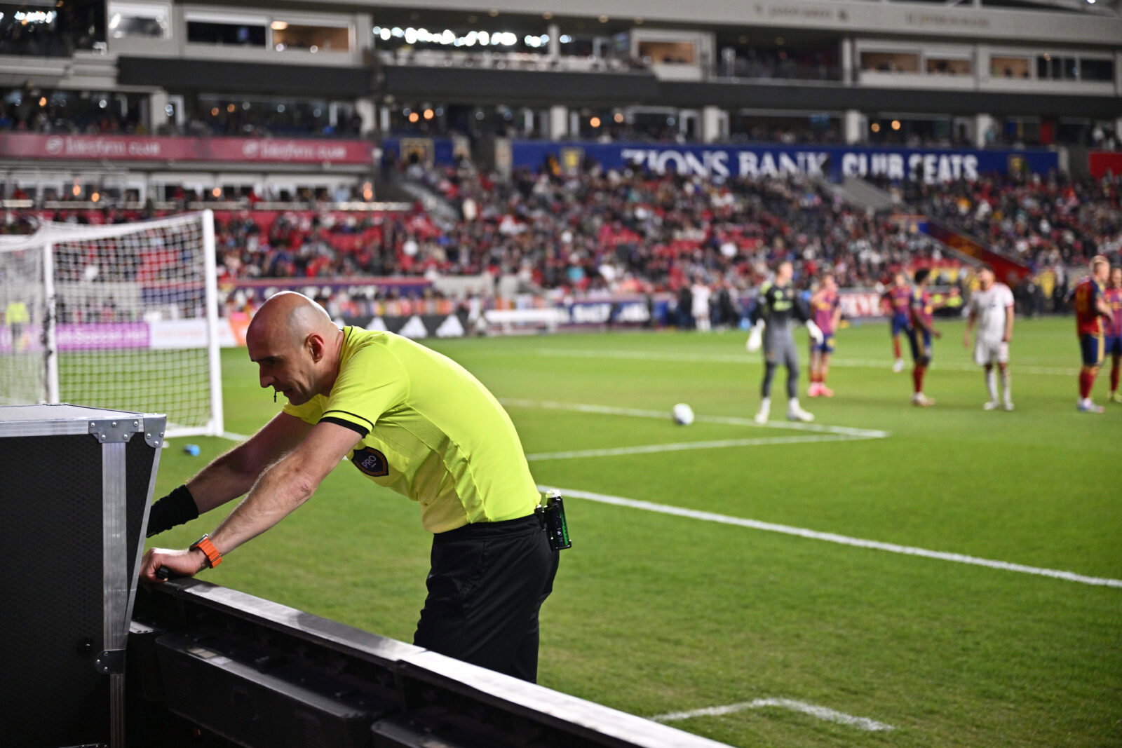 Apr 19, 2025; Sandy, Utah, USA; Referee Sergii Demianchuk checks the video assisted review after issuing a red card to Real Salt Lake midfielder Diego Luna (8) in the second half against Toronto FC at America First Field. Mandatory Credit: Jamie Sabau-Imagn Images