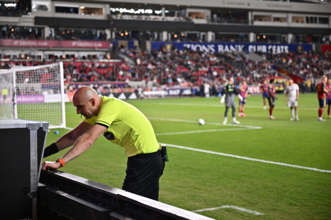Apr 19, 2025; Sandy, Utah, USA; Referee Sergii Demianchuk checks the video assisted review after issuing a red card to Real Salt Lake midfielder Diego Luna (8) in the second half against Toronto FC at America First Field. Mandatory Credit: Jamie Sabau-Imagn Images