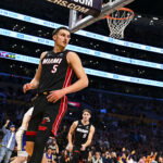 Nov 2, 2025; Los Angeles, California, USA; Miami Heat forward Nikola Jovic (5) looks to the sidelines with guard Pelle Larsson (9) and guard Davion Mitchell (45) against the Los Angeles Lakers during the second half at Crypto.com Arena. Mandatory Credit: Jonathan Hui-Imagn Images