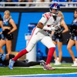 New York Giants quarterback Jameis Winston (19) makes a catch against Detroit Lions linebacker Derrick Barnes (55) during the second half at Ford Field in Detroit on Sunday, Nov. 23, 2025.