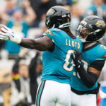 Dec 7, 2025; Jacksonville, Florida, USA; Jacksonville Jaguars linebacker Devin Lloyd (0) and Jacksonville Jaguars safety Eric Murray (29) celebrate after an interception against the Indianapolis Colts during the first half at EverBank Stadium. Mandatory Credit: Matt Pendleton-Imagn Images