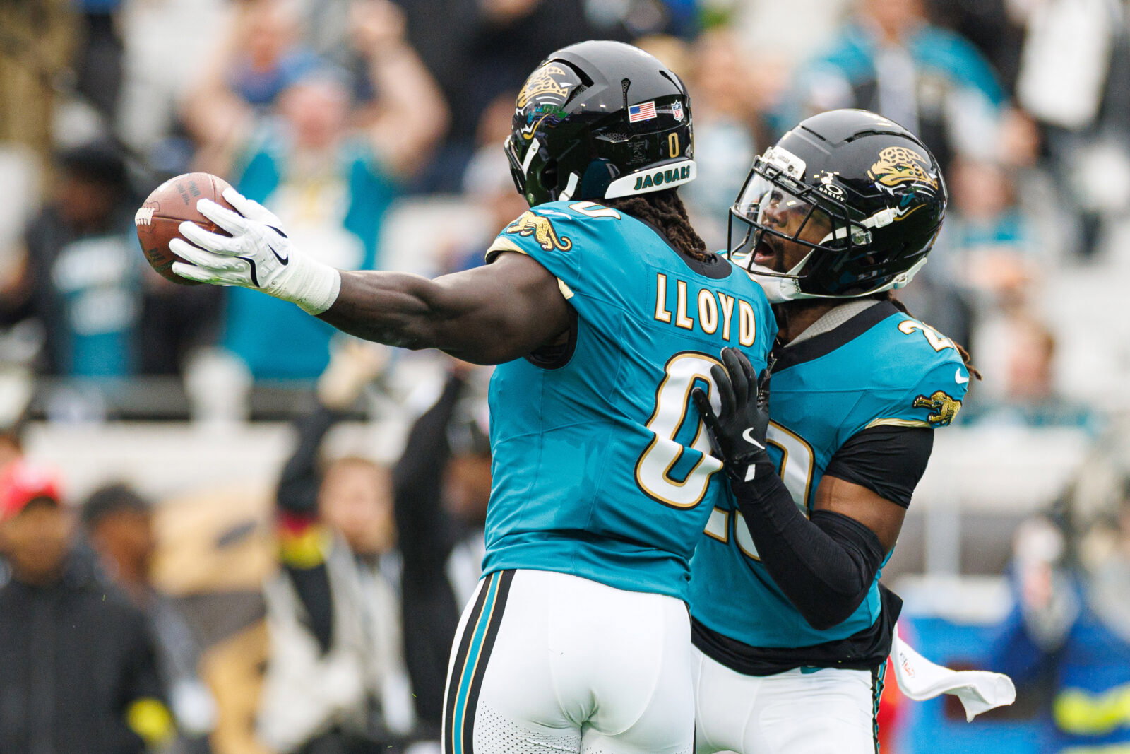 Dec 7, 2025; Jacksonville, Florida, USA; Jacksonville Jaguars linebacker Devin Lloyd (0) and Jacksonville Jaguars safety Eric Murray (29) celebrate after an interception against the Indianapolis Colts during the first half at EverBank Stadium. Mandatory Credit: Matt Pendleton-Imagn Images