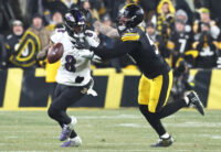 Jan 4, 2026; Pittsburgh, Pennsylvania, USA; Baltimore Ravens quarterback Lamar Jackson (8) scrambles with the ball as Pittsburgh Steelers linebacker Nick Herbig (51) cases during the fourth quarter at Acrisure Stadium. Mandatory Credit: Charles LeClaire-Imagn Images