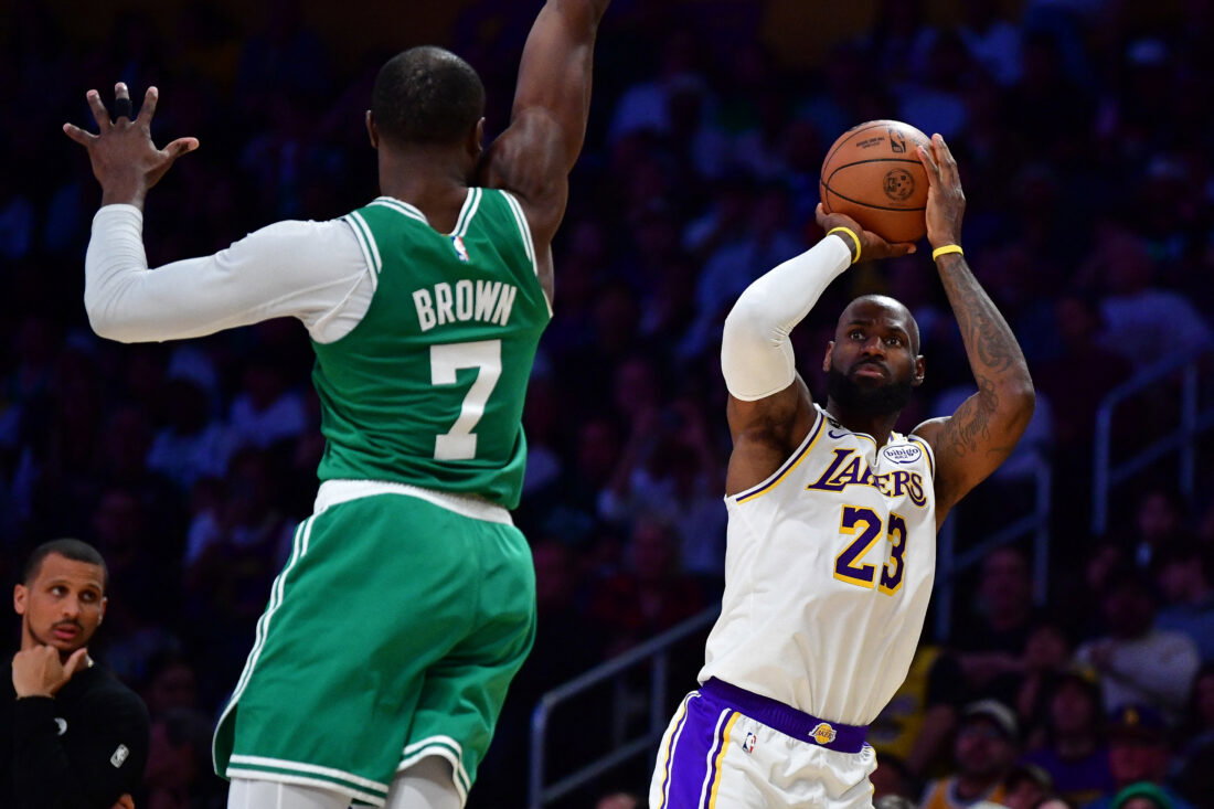 Feb 22, 2026; Los Angeles, California, USA; Los Angeles Lakers forward LeBron James (23) shoots against Boston Celtics guard Jaylen Brown (7) during the second half at Crypto.com Arena. Mandatory Credit: