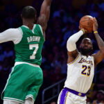 Feb 22, 2026; Los Angeles, California, USA; Los Angeles Lakers forward LeBron James (23) shoots against Boston Celtics guard Jaylen Brown (7) during the second half at Crypto.com Arena. Mandatory Credit: