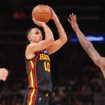 Mar 21, 2026; Atlanta, Georgia, USA; Atlanta Hawks forward Zaccharie Risacher (10) shoots against the Golden State Warriors in the second quarter at State Farm Arena. Mandatory Credit: Brett Davis-Imagn Images