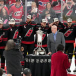 May 29, 2026; Raleigh, North Carolina, USA; NHL deputy commissioner Bill Daly and the Carolina Hurricanes pose for a photo with the Prince of Wales Trophy after Carolina defeated the Montreal Canadiens in game five of the Eastern Conference Final of the 2026 Stanley Cup Playoffs at Lenovo Center. Mandatory Credit: James Guillory-Imagn Images
