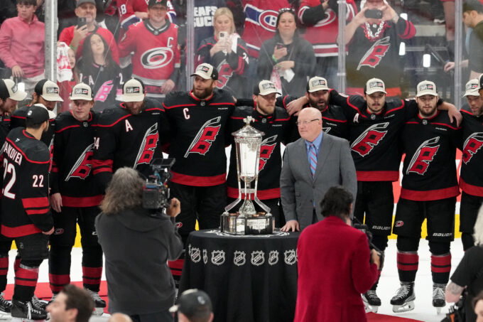 May 29, 2026; Raleigh, North Carolina, USA; NHL deputy commissioner Bill Daly and the Carolina Hurricanes pose for a photo with the Prince of Wales Trophy after Carolina defeated the Montreal Canadiens in game five of the Eastern Conference Final of the 2026 Stanley Cup Playoffs at Lenovo Center. Mandatory Credit: James Guillory-Imagn Images