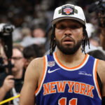 Jun 13, 2026; San Antonio, Texas, USA; New York Knicks guard Jalen Brunson (11) walks to the end of the court prior to the championship trophy celebration after game five of the 2026 NBA Finals against the San Antonio Spurs at Frost Bank Center. Mandatory Credit: Geoff Burke-Imagn Images