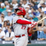 Jul 21, 2026; Seattle, Washington, USA; Cincinnati Reds first baseman Sal Stewart (27) hits an RBI-sacrifice fly against the Seattle Mariners during the fifth inning at T-Mobile Park. Mandatory Credit: Joe Nicholson-Imagn Images