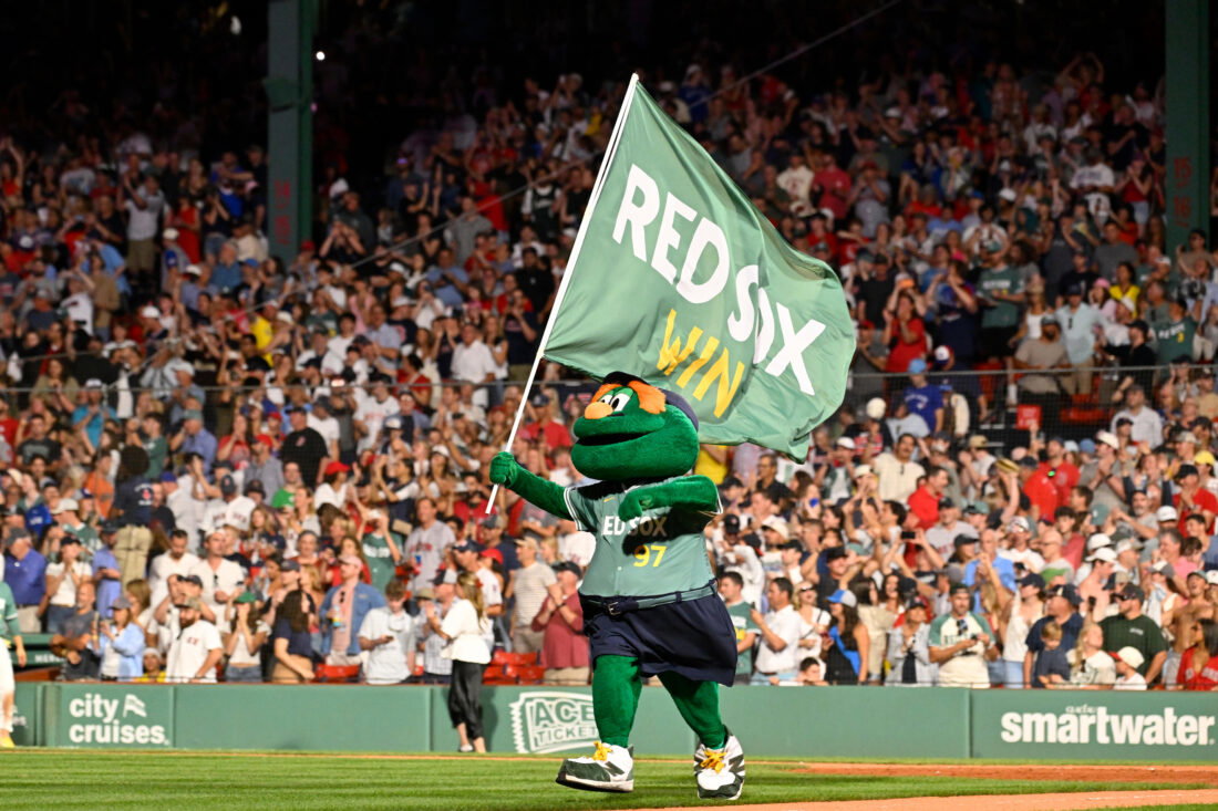 Jul 24, 2026; Boston, Massachusetts, USA; Boston Red Sox mascot Wally celebrates the team's victory over the Toronto Blue Jays during the ninth inning at Fenway Park. Mandatory Credit: Eric Canha-Imagn Images