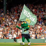 Jul 24, 2026; Boston, Massachusetts, USA; Boston Red Sox mascot Wally celebrates the team's victory over the Toronto Blue Jays during the ninth inning at Fenway Park. Mandatory Credit: Eric Canha-Imagn Images