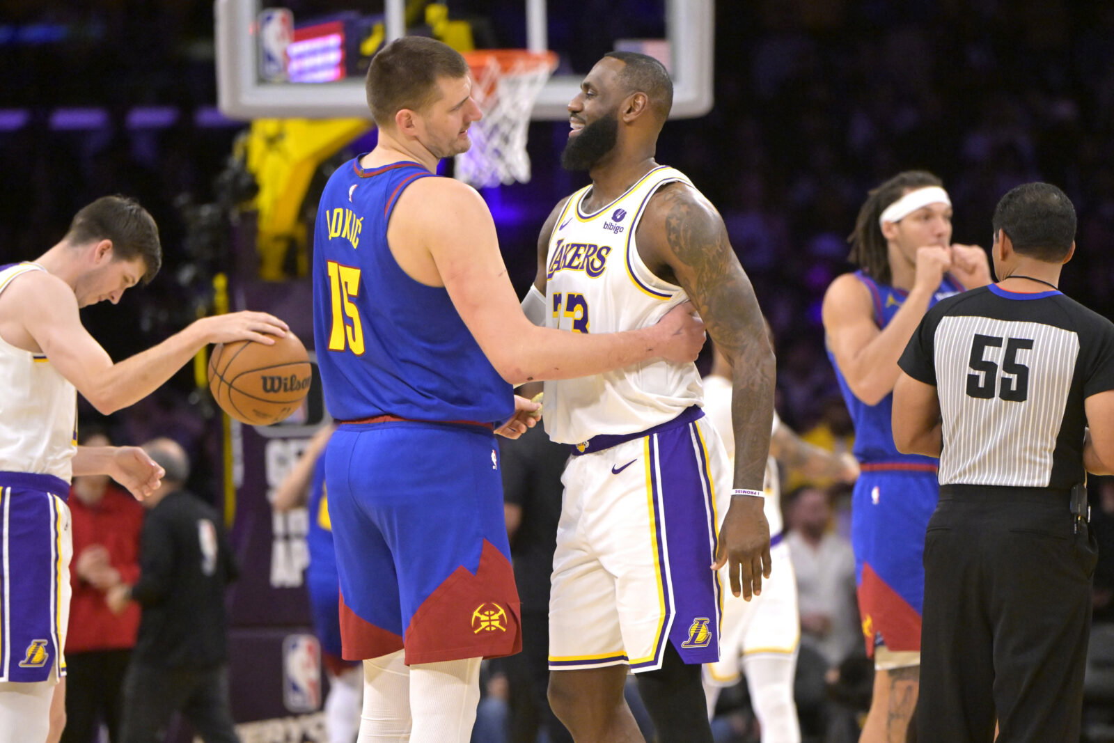 Mar 2, 2024; Los Angeles, California, USA; Los Angeles Lakers forward LeBron James (23) is greeted by Denver Nuggets center Nikola Jokic (15) at the start of the game at Crypto.com Arena. Mandatory Credit: Jayne Kamin-Oncea-USA TODAY Sports