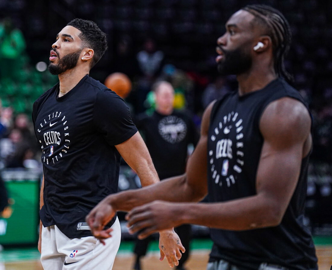 Jan 10, 2025; Boston, Massachusetts, USA; Boston Celtics forward Jayson Tatum (0) and guard Jaylen Brown (7) warm up before the start of the game against the Sacramento Kings at TD Garden. Mandatory Credit: