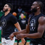 Jan 10, 2025; Boston, Massachusetts, USA; Boston Celtics forward Jayson Tatum (0) and guard Jaylen Brown (7) warm up before the start of the game against the Sacramento Kings at TD Garden. Mandatory Credit: