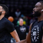 Jan 10, 2025; Boston, Massachusetts, USA; Boston Celtics forward Jayson Tatum (0) and guard Jaylen Brown (7) warm up before the start of the game against the Sacramento Kings at TD Garden. Mandatory Credit:
