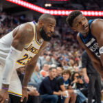 Apr 27, 2025; Minneapolis, Minnesota, USA; Minnesota Timberwolves guard Anthony Edwards (5) guards Los Angeles Lakers forward LeBron James (23) in the second quarter during game four of first round for the 2025 NBA Playoffs at Target Center. Mandatory Credit: Matt Blewett-Imagn Images
