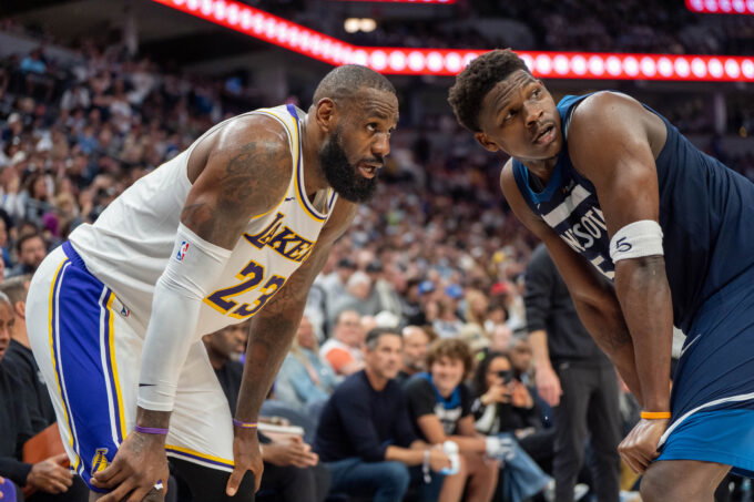 Apr 27, 2025; Minneapolis, Minnesota, USA; Minnesota Timberwolves guard Anthony Edwards (5) guards Los Angeles Lakers forward LeBron James (23) in the second quarter during game four of first round for the 2025 NBA Playoffs at Target Center. Mandatory Credit: Matt Blewett-Imagn Images