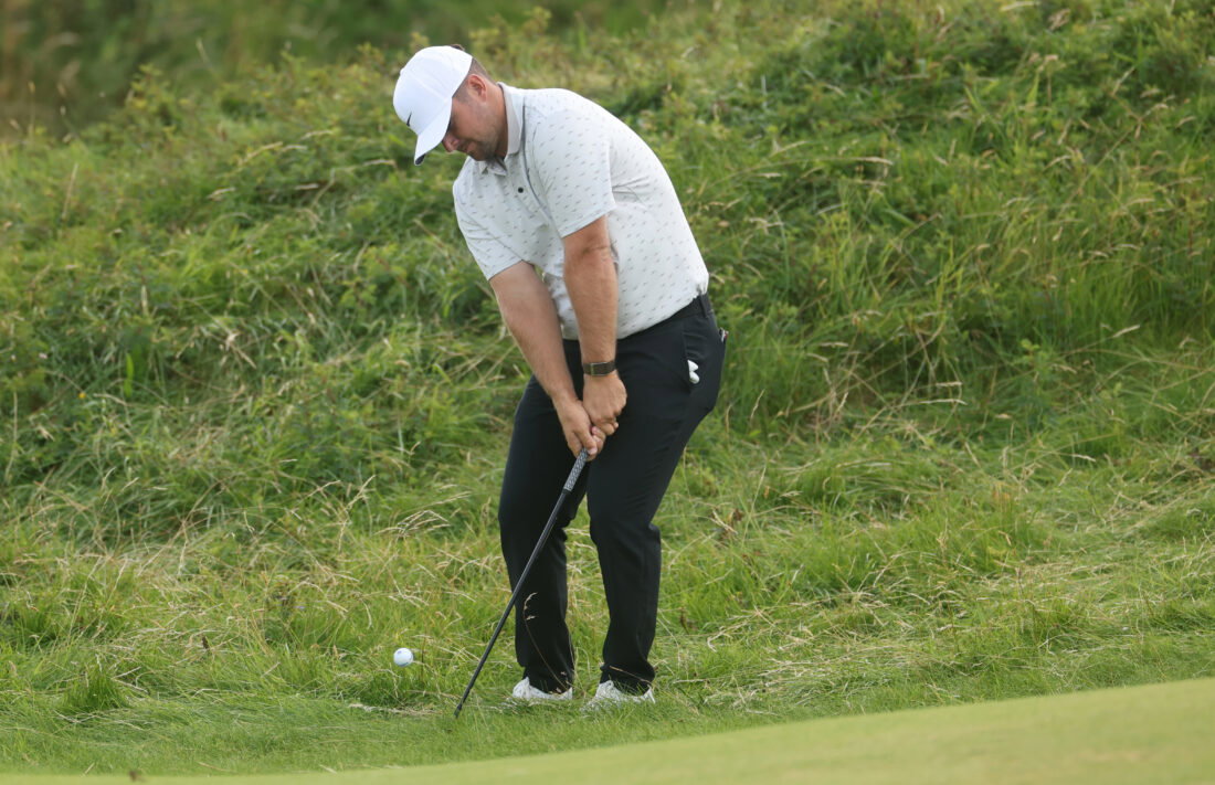 Jul 19, 2025; Portrush, IRL; Chris Gotterup chips on the tenth hole during the third round of The 153rd Open Championship golf tournament. Mandatory Credit: Mike Frey-Imagn Images