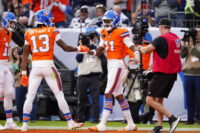 Oct 26, 2025; Denver, Colorado, USA; Denver Broncos wide receiver Troy Franklin (11) celebrates with wide receiver Pat Bryant (13) after scoring a touchdown against the Dallas Cowboys in the fourth quarter at Empower Field at Mile High. Mandatory Credit: Ron Chenoy-Imagn Images